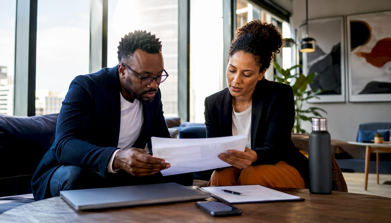 Startup founder reviewing hiring compliance documents