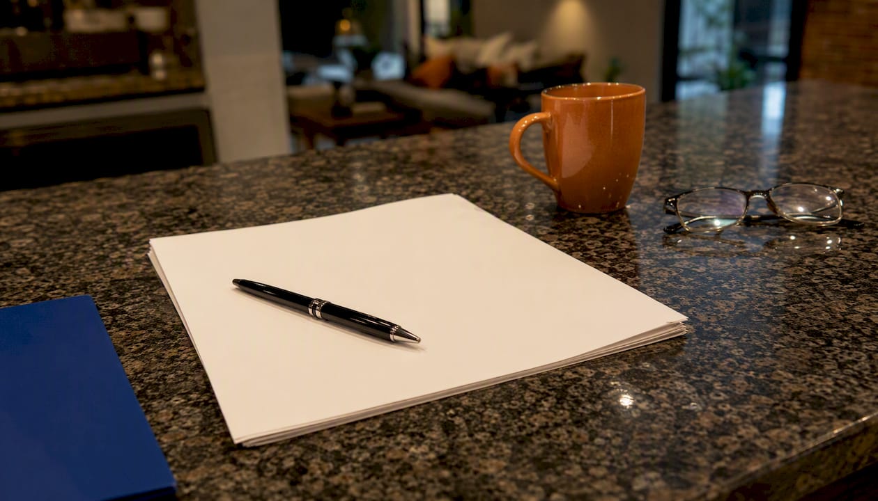 Unsigned employment contract with pen on desk