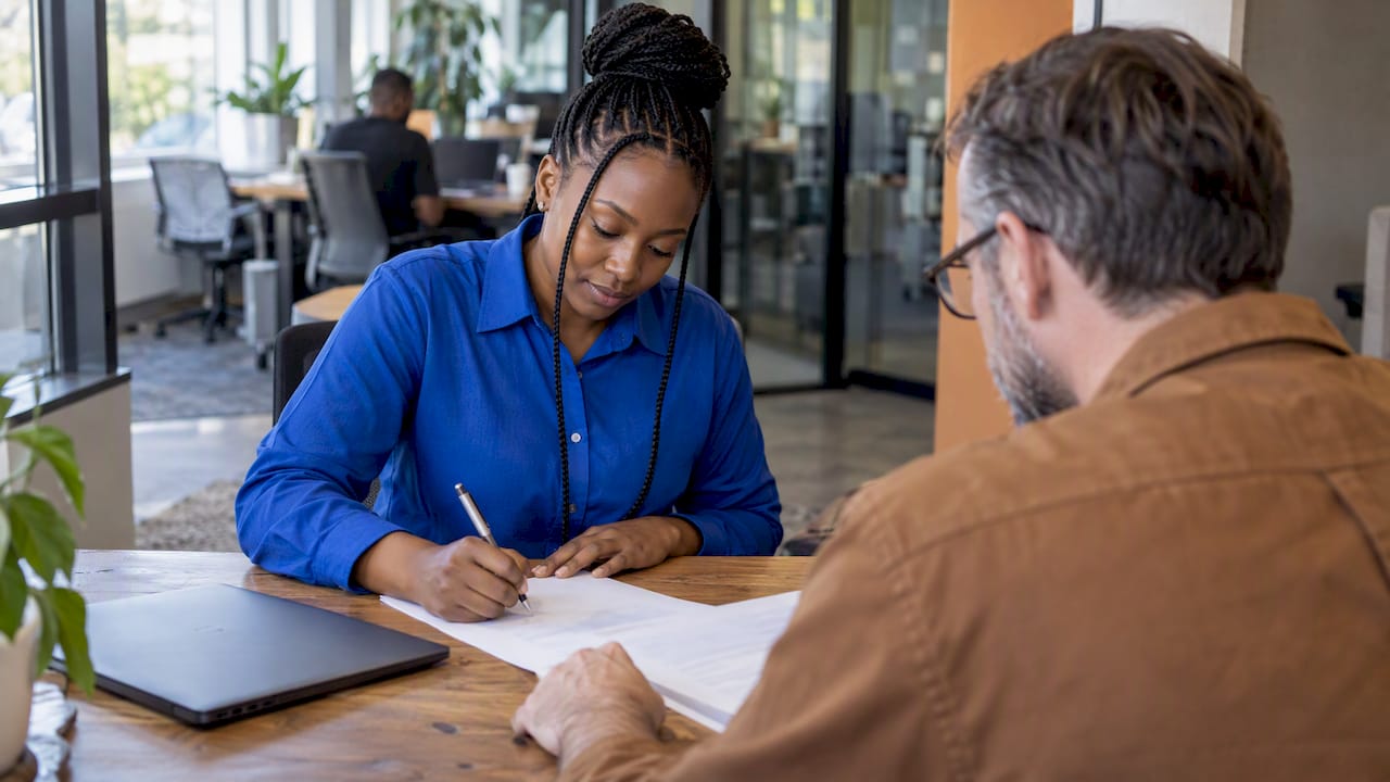 Employee signing South African employment agreement